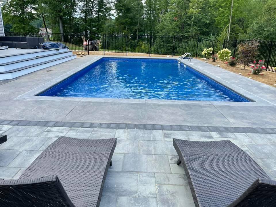 Inground pool with stamped concrete patio in Albany, NY