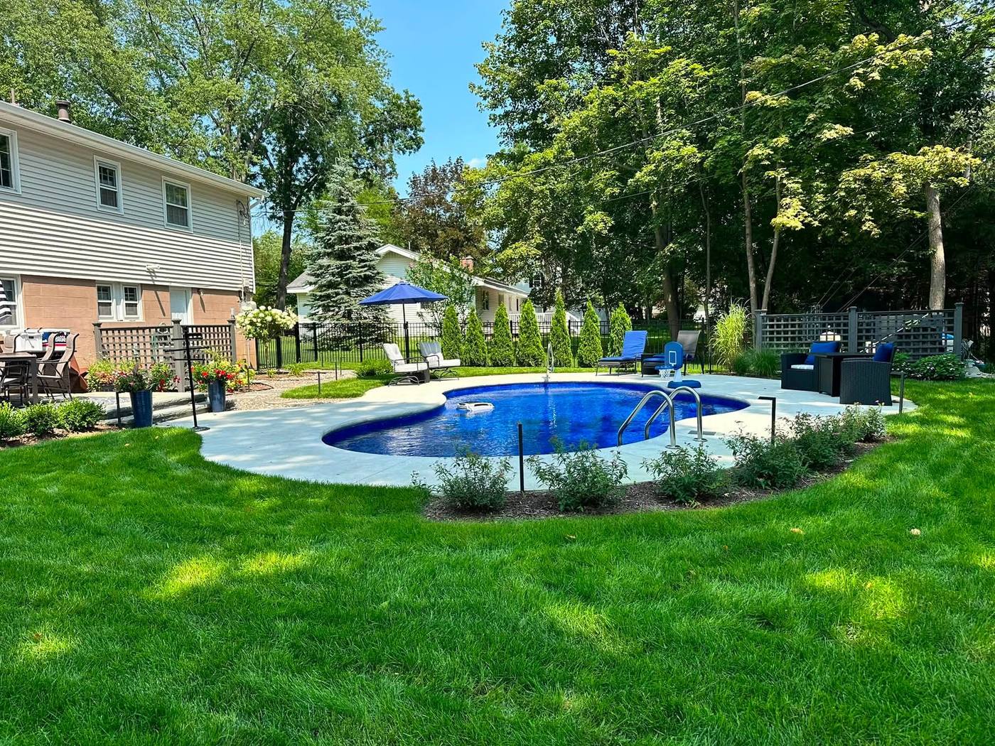 New kidney-shaped inground pool installation by Tri-City Pools