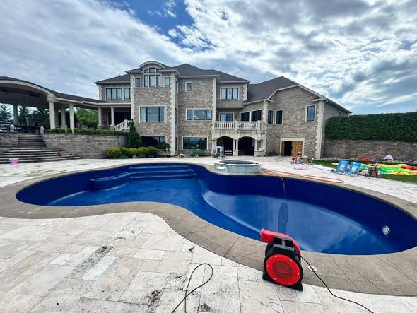 New inground pool with blue vinyl liner