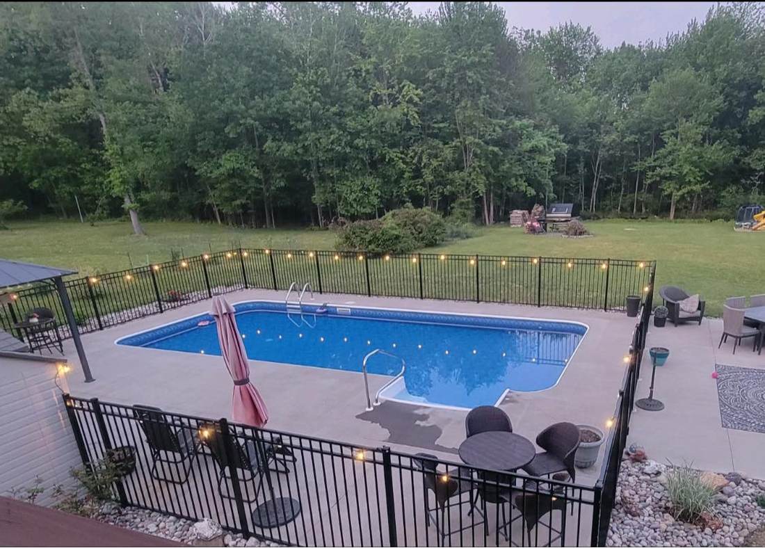 Pool with string lighting in Columbia County