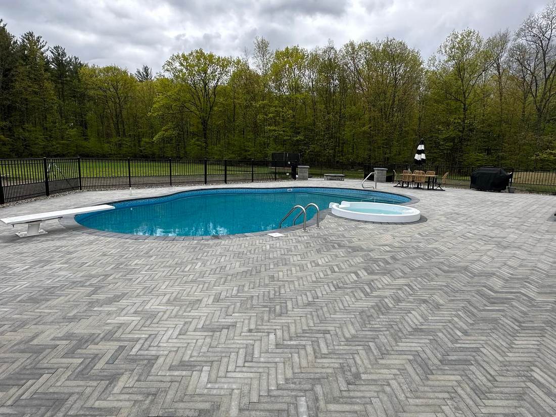 Inground pool with diving board and spa in Rensselaer County